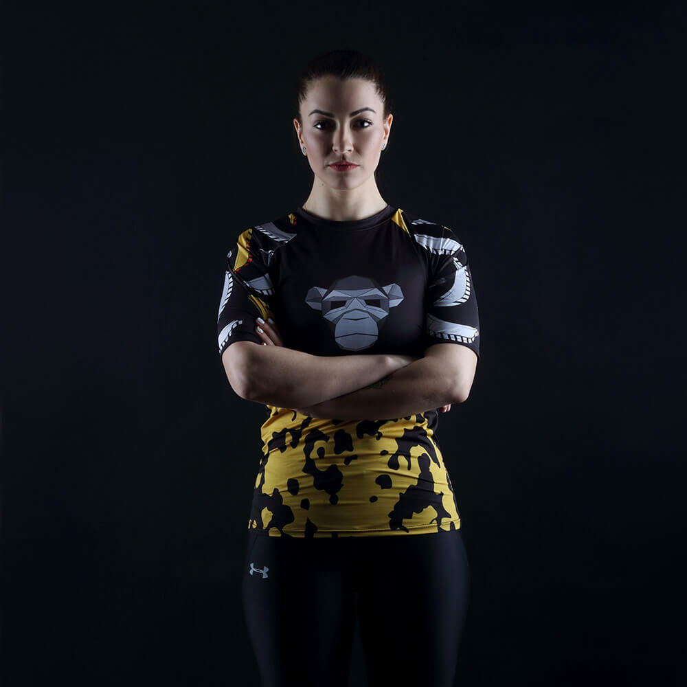 fashion photo of a woman in a design T-shirt on a dark background