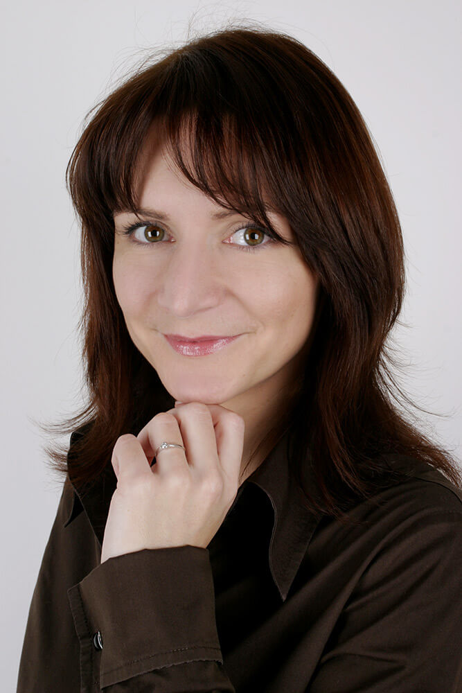 female business portrait in a dark shirt on a white background